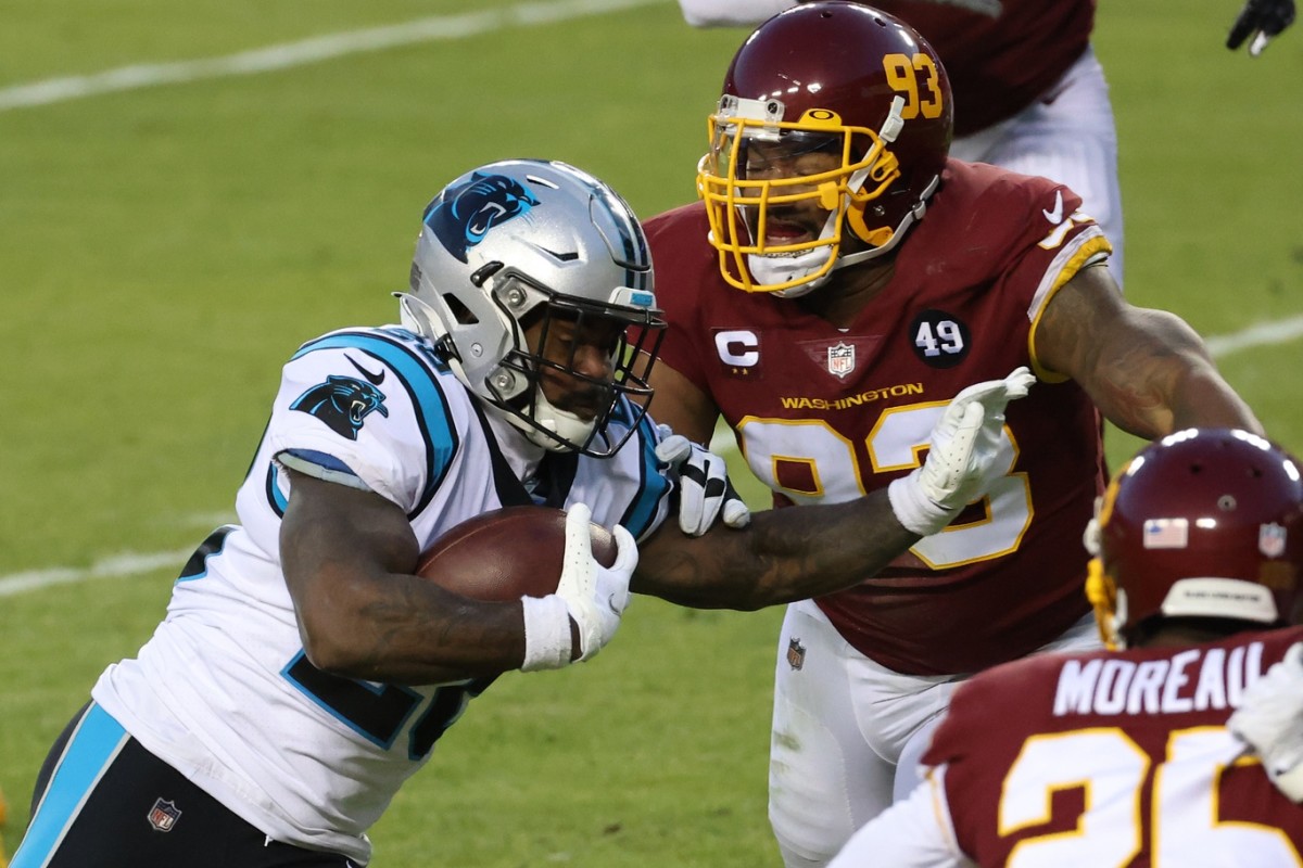 Mike Davis carries the ball against the Washington Football Team. 